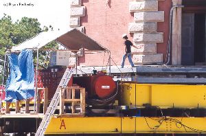 DURING MOVE: A worker walks out from the tower towards the control station.