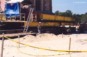 DURING MOVE: A worker getting ready to go beneath the tower.