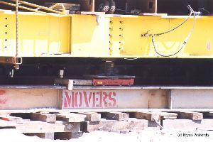 DURING MOVE: Rollers used to move the tower. It