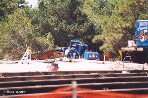 DURING MOVE: A pump at the site to keep water out.
