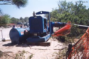 DURING MOVE: Water pump to keep sea water out of the hole.