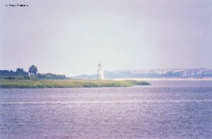 Lighthouse, water in foreground.