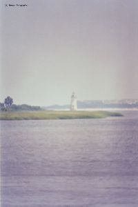 Lighthouse, water in foreground.