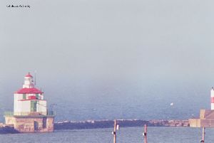 Lighthouse and red pier light.