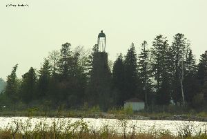 The lighthouse and its birdcage lantern room.