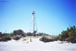 The tower sits off of the beach.