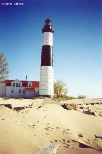 The sand dunes and the lighthouse tower.