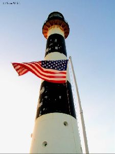 The U.S. Flag flies in front of the tower.