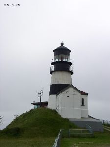 The lighthouse against the gray sky.