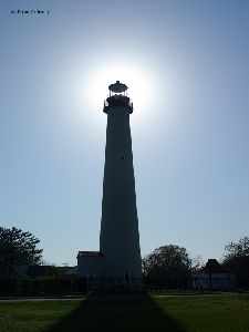 The sun behind the tower.