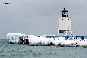Snow covered pier with the tower.