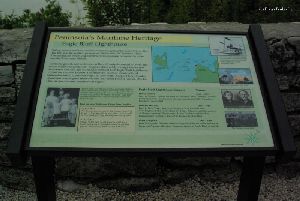 Eagle Bluff sign by lighthouse.