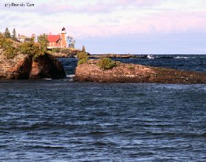 Great shot looking across the water at the light.