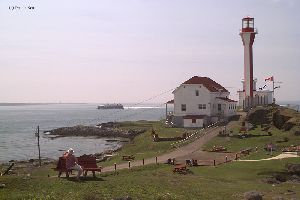 A ferry boat approaches the harbor.