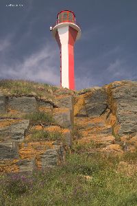 A view from the beach looking up at the lighthouse.