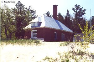 The fog signal building from the beach.