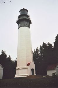 The Grays Harbor Lighthouse against a grey sky.