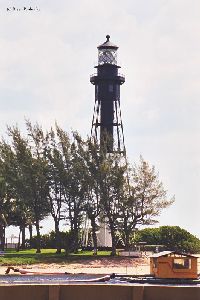 Lighthouse close up from across canal.