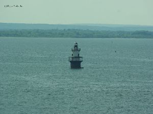 The lighthouse in the middle of the bay.