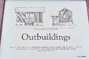 Outbuilding plaque explaining what they were used for.