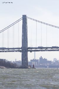 The lighthouse sits under the George Washington Bridge.