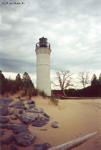 The lighthouse and some rocky sand dunes.