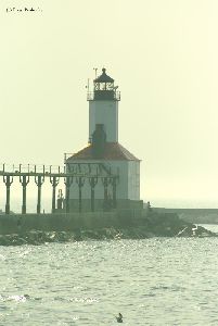 The sun sets on the lighthouse.