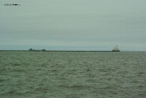 A ship gets ready to enter the harbor.