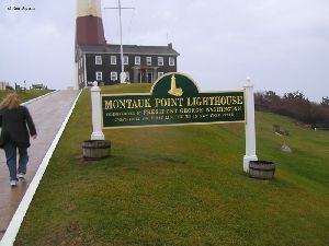Sign in front of lighthouse.