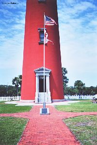 Flagpole and lighthouse entrance.