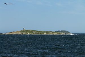 Pond Island Lighthouse with Seguin Island Lighthouse in the background.