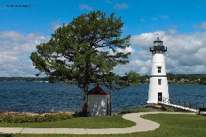 Lighthouse, generator house, and tree.