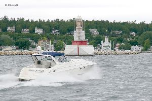 A boat passes by the tower.