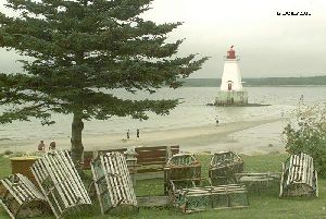 Lobster traps are for decoration. Sandy Point Lighthouse in the background.