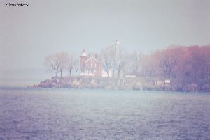 Distance shot of lighthouse with morning haze.