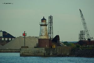 Lighthouse and its industrial background.