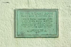 Plaque on the wall of the tower.