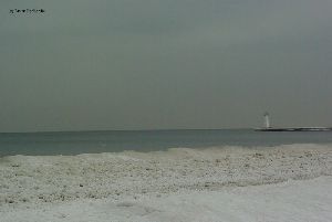 Ice collects near the shore.