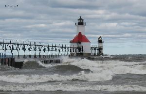The waves roar by the lighthouse.