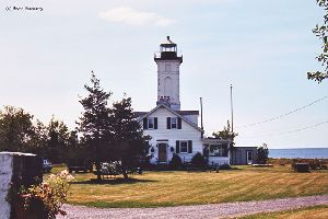 Lighthouse with lake in the background.