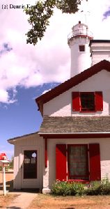 Edge of the quarters with the tower peeking over roof.