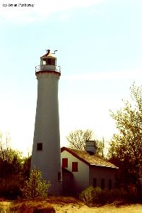 The lighthouse and quarters on the beach.