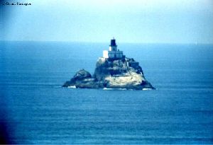 The lighthouse stands unprotected against the mighty Pacific.